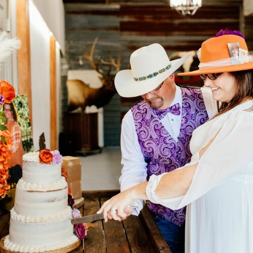 Bride and Groom Cutting Cake